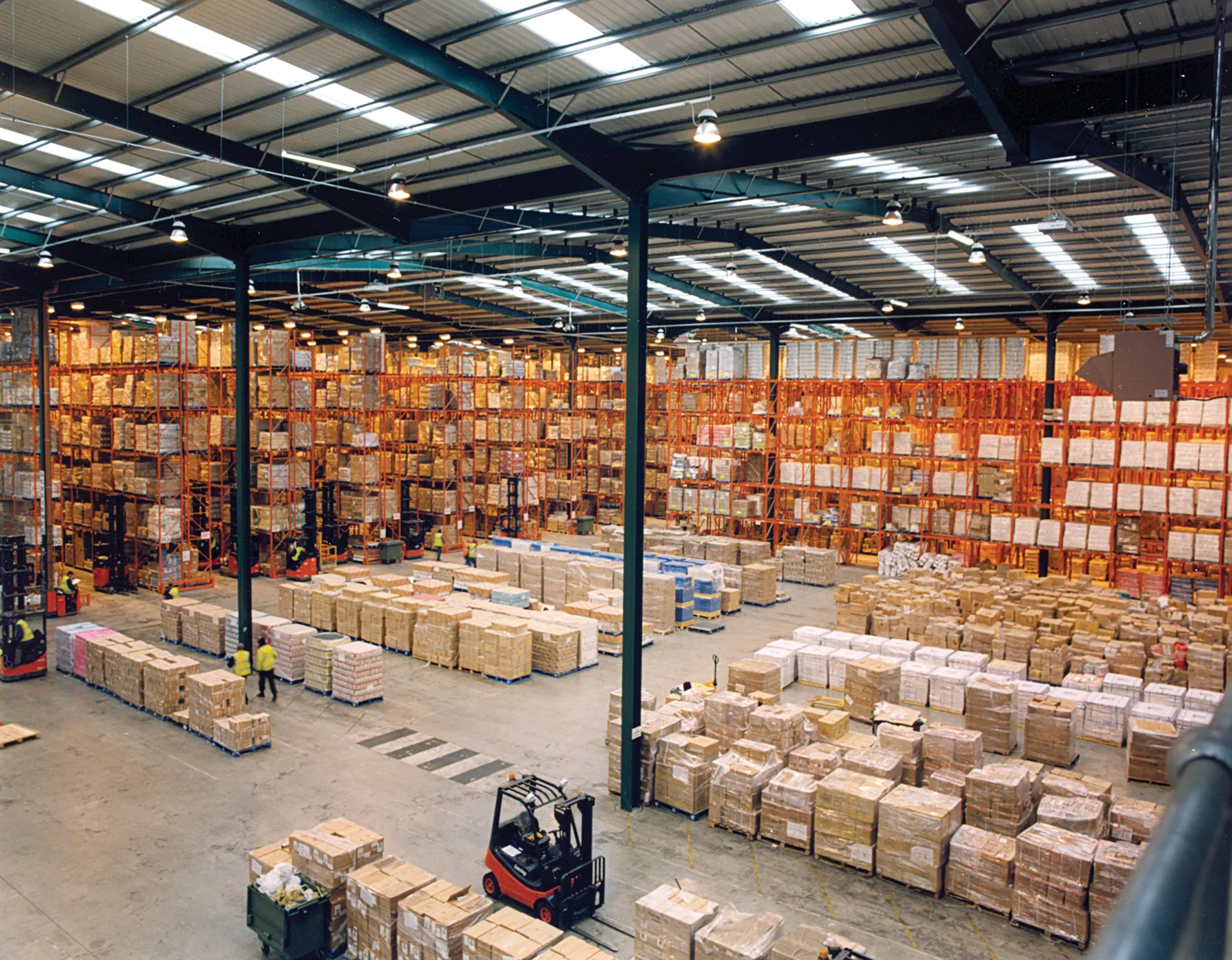 Pallet racking stacked with cartons in a large warehouse